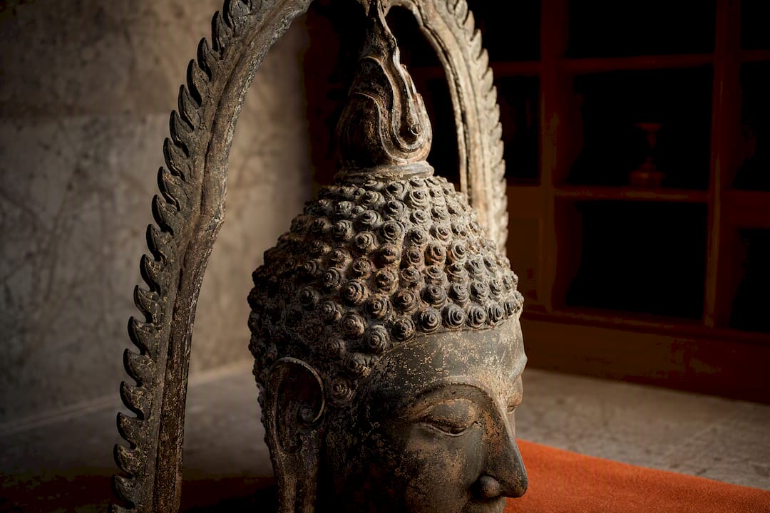 Thai Buddha flame finial and curled hair