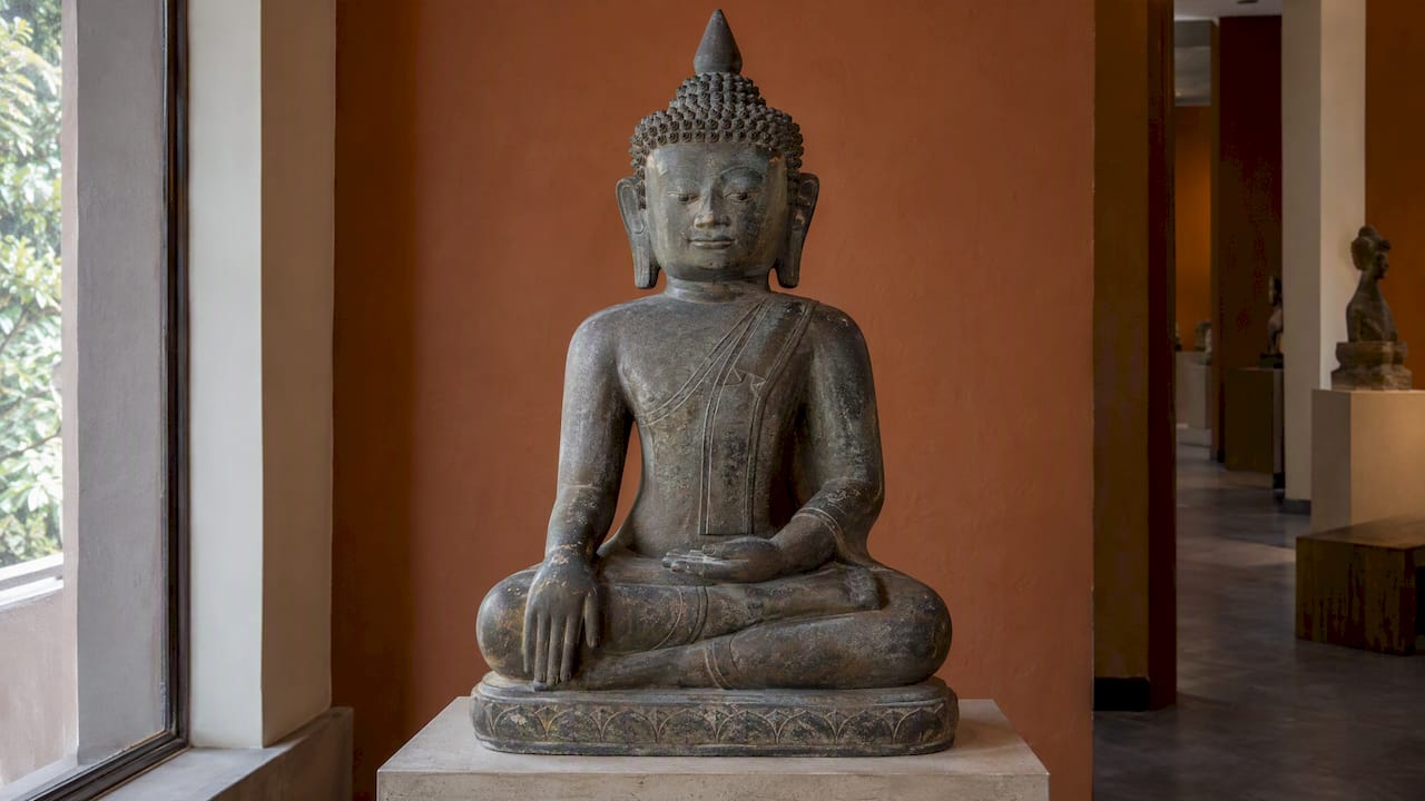 Seated Shan-style Buddha with broad flat face